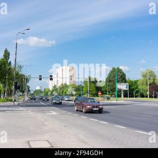 POZNAN, POLAND - Oct 18, 2015: Cars driving on a street with traffic lights Stock Photo