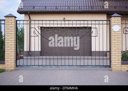Metal sliding gates for entering a garage private house Stock Photo