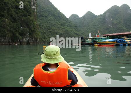 Photographs of group kayaking in Halong Bay, Vietnam. Taken from multiple perspectives during daytime on 06/01/20. Stock Photo