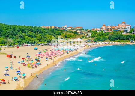People are enjoying sunny day on Butamyata beach near Sinemorets in Bulgaria. Stock Photo