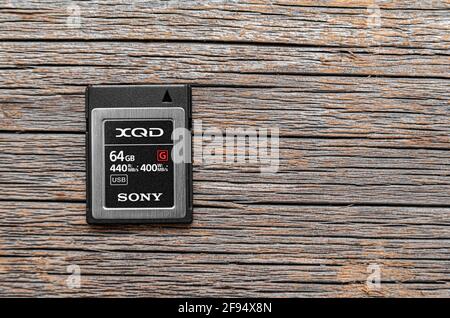 Sony XQD memory card on a wooden background. Stock Photo