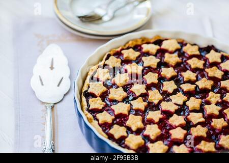 Homemade cream dough cake, pie on a wooden background. Stock Photo