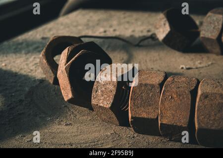 Rusty old screw nuts, shown in a museum of an old coal mine Stock Photo