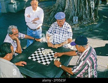 men playing domino outdoor in Plaza de Hostos, Old San Juan,San Juan, Puerto  Rico Island, Caribbean Stock Photo - Alamy