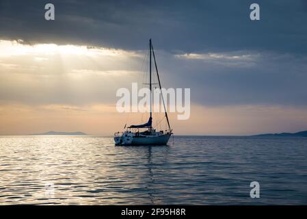 Sunset on the Aegean Sea from the Greek Island of Mykonos. Stock Photo