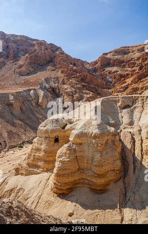 Cave of the Dead Sea Scrolls, known as Qumran cave 4, one of the caves in which the scrolls were found at the ruins of Khirbet Qumran in the desert of Stock Photo