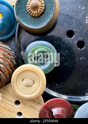 Multi-colored antique or vintage sewing buttons: Celluloid Buttons, Bakelite Buttons, Lucite Buttons, vegetable Ivory, metal, china, glass, plastic Stock Photo
