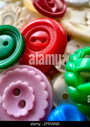 Multi-colored antique or vintage sewing buttons: Celluloid Buttons, Bakelite Buttons, Lucite Buttons, vegetable Ivory, metal, china, glass, plastic Stock Photo