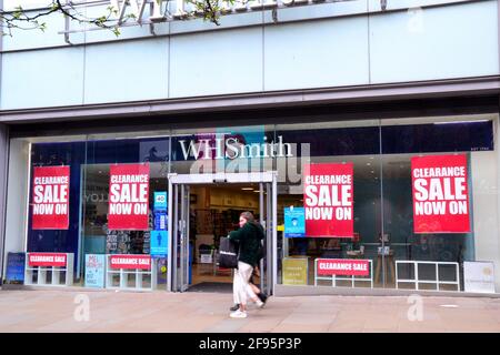 A W H Smith store or shop in Market Street, Manchester, Greater Manchester, England, United Kingdom, which displays 'clearance sale' posters on April 16th, 2021. The media report several other W H Smith stores in England are currently having clearance sales. The Covid 19 or Coronavirus lockdown has hit bricks and mortar stores hard. In November 2020 W H Smith reported a pretax loss of £226 million, compared with a profit of £135 million in 2019. Stock Photo
