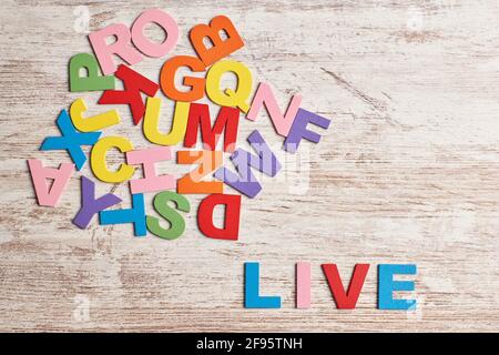 Colors alphabet letters in a clear wood background Stock Photo