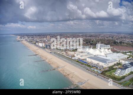 Aerial video of West Sussex coast from of the resort of Bognor Regis and Butlins Holiday Village on a warm and sunny Spring day in England. Stock Photo