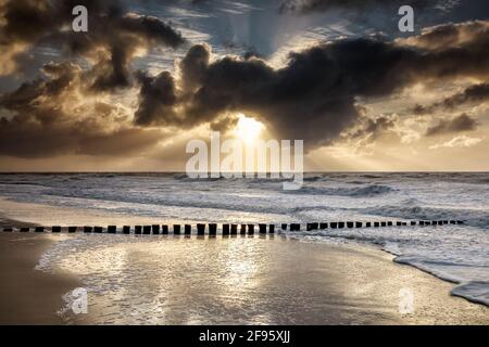 dramatic sky over stormy sea, Netherlands Stock Photo