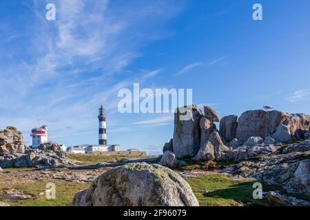 Lighthouse and Beacon of Ouessant, the island of Ushant, in Brittany, french rocky beach in northern France, Finistere department, Europe Stock Photo