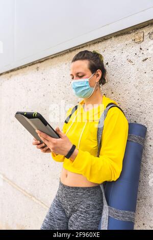 Active woman with sportswear and tablet taking a selfie Stock Photo