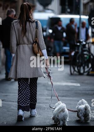 MILAN, ITALY - SEPTEMBER 21, 2018: Woman with brown checkered