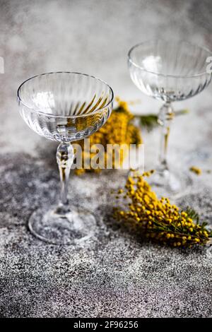 Mimosa drink glasses and flowers Stock Photo