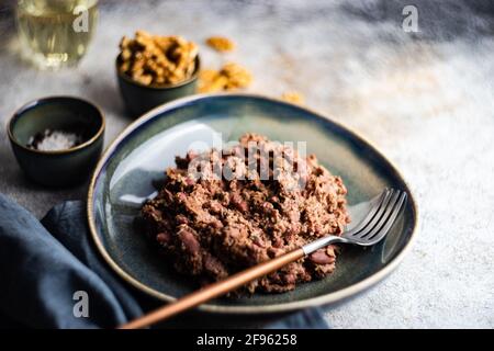 Traditional georgian bean dish with walnuts Stock Photo