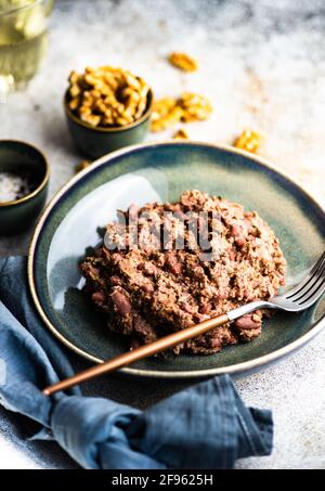 Traditional georgian bean dish with walnuts Stock Photo