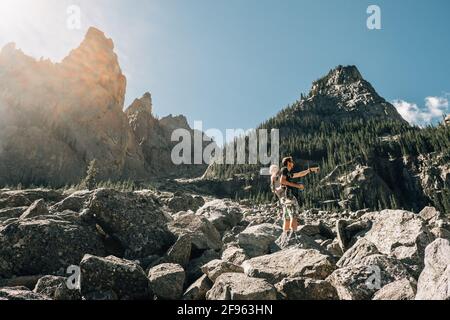 Father hiking with his young daughter in a carrier Stock Photo