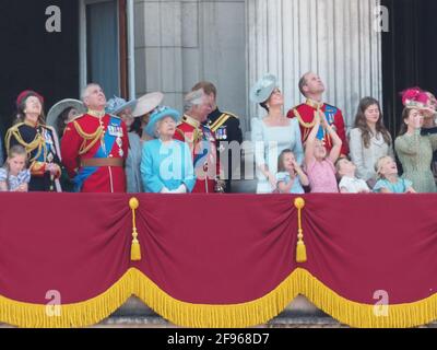 Members of the royal family join HRH The Queen on the balcony of Buckingham Palace to watch the traditional fly past. Prince George and Princess Charlotte seemed particularly excited by the Red Arrows. The Duchess of Cambridge could be seen giving Princess Charlotte a gentle cuddle at one point. The newly married Duke of Sussex and Duchess of Sussex were seen chatting with the Duke's father, Prince Charles.  9 June 2018.  Please byline: Vantagenews.com Stock Photo