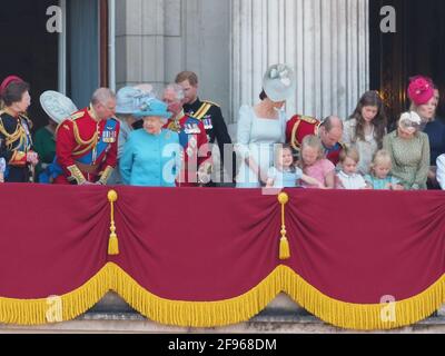 Members of the royal family join HRH The Queen on the balcony of Buckingham Palace to watch the traditional fly past. Prince George and Princess Charlotte seemed particularly excited by the Red Arrows. The Duchess of Cambridge could be seen giving Princess Charlotte a gentle cuddle at one point. The newly married Duke of Sussex and Duchess of Sussex were seen chatting with the Duke's father, Prince Charles.  9 June 2018.  Please byline: Vantagenews.com Stock Photo