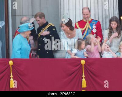 Members of the royal family join HRH The Queen on the balcony of Buckingham Palace to watch the traditional fly past. Prince George and Princess Charlotte seemed particularly excited by the Red Arrows. The Duchess of Cambridge could be seen giving Princess Charlotte a gentle cuddle at one point. The newly married Duke of Sussex and Duchess of Sussex were seen chatting with the Duke's father, Prince Charles.  9 June 2018.  Please byline: Vantagenews.com Stock Photo