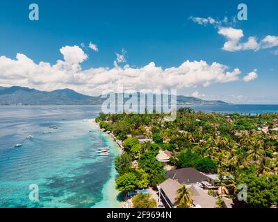 Tropical island with village, beach and turquoise crystal ocean, aerial view. Gili Air island Stock Photo