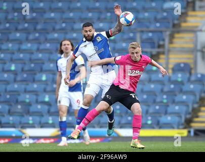 Blackburn Rovers' Bradley Johnson (left) and Derby County's Louie Sibley battle for the ball a during the Sky Bet Championship match at Ewood Park, Blackburn. Picture date: Friday April 16, 2021. Stock Photo