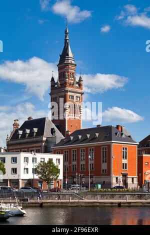 Dunkerque, France - June 22 2020: The Port du Bassin du Commerce with the belfry of the Dunkirk city hall behind it. Stock Photo