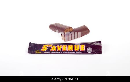 5th Avenue Candy Bar from The Hershey Company with Peanut Butter Crunch and Milk Chocolate out of Wrapper isolated on White Stock Photo