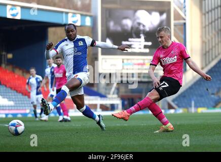 Derby County's Louie Sibley (right) shoots towards goal as Blackburn Rovers' Ryan Nyambe attempts to block it during the Sky Bet Championship match at Ewood Park, Blackburn. Picture date: Friday April 16, 2021. Stock Photo