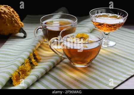 Cup of healthy dandelion tea with honey. Vitamin drink. Herbal medicine. Copy space. Stock Photo