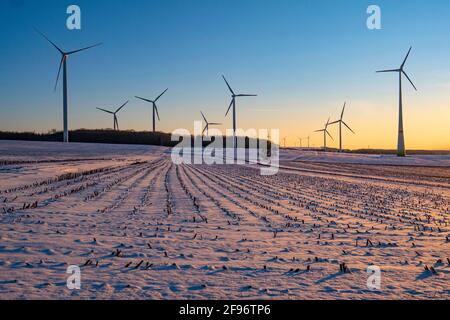 Wind turbines in winter landscape near Kirf on the Saargau, Rhineland-Palatinate, Germany Stock Photo