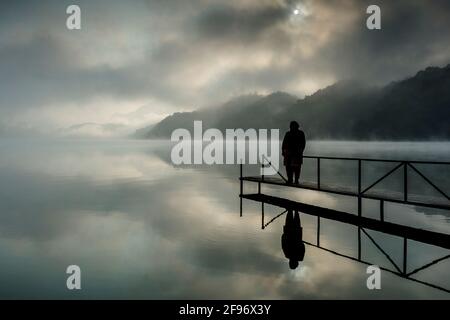 the lake Begnas valley, being separated from loved ones, the truth about ending suffering Stock Photo