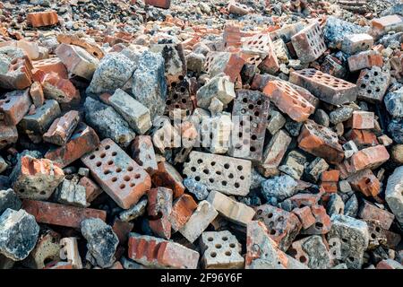 Debris of a destroyed brick fabric which has burned down to its foundation. Stock Photo