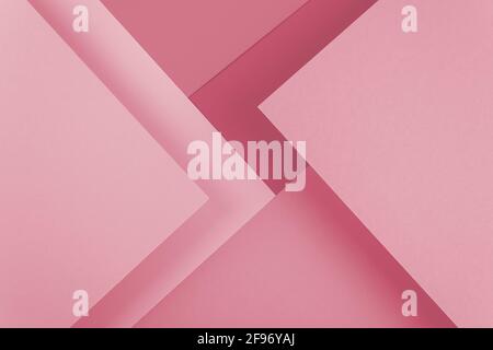 Abstract pastel pink colored paper texture. Geometric shapes and lines. Minimalist background. Flat lay. Copy space. Stock Photo