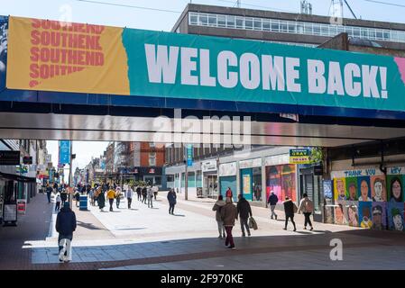 Welcome back message on bridge, High Street, Southend on Sea, Essex, UK, as England moves to step 2 of roadmap out of COVID 19 lockdown, with shoppers Stock Photo