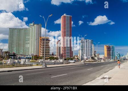 HAVANA, CUBA - FEB 21, 2016: Famous seaside drive Malecon in Havana. Skyline of Vedado neighborhood in the background. Stock Photo