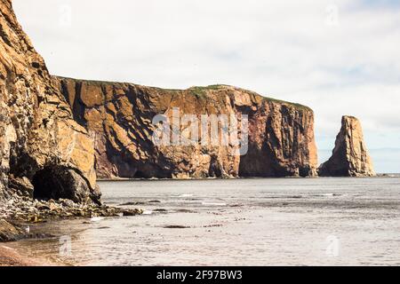 The huge sheer rock formations in the Gulf of Saint Lawrence on the tip of the Gaspé Peninsula in Québec, Canada. Stock Photo