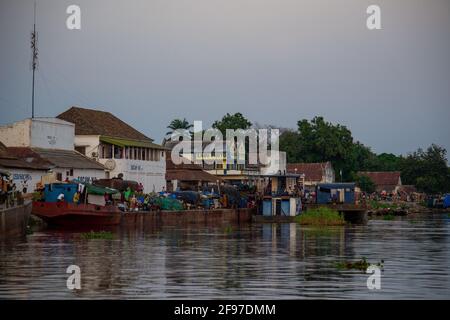 Floating down the Congo river, passengers and cargo together on a barge Stock Photo