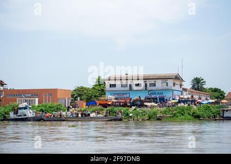 The city of Bumba, from the a very slow moving barge floating down Congo river, Democratic Republic of Congo. Stock Photo
