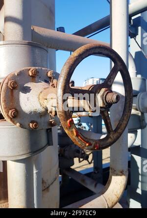 Closing or opening for gas or water supply through a pipeline. Shut-off valves on the pipeline close-up Stock Photo