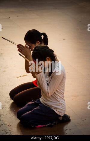 Laos, Pakse, the temple Vat Phou Salao, two women, prayer, Stock Photo