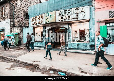 On the streets in Addis Ababa, Ethiopia, Africa. Lots of Traffic, many people - but also nature, simple living in a rough environment. colorful. Stock Photo
