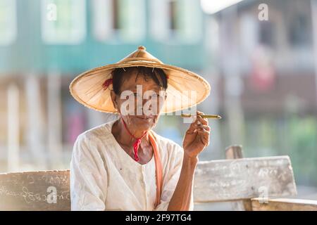 Myanmar, scenes at Inle Lake, in the pagoda forest Kakku, senior citizen, hat, cigarette, Stock Photo