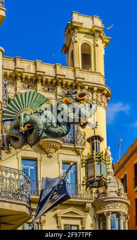 View of Casa Bruno Cuadros famous for being decorated with umbrellas and a dragon statue Stock Photo