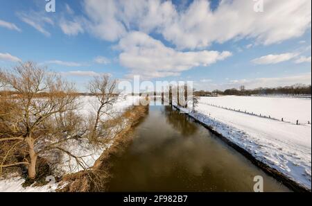 Schermbeck, North Rhine-Westphalia, Germany - Sunny winter landscape in the Ruhr area, ice and snow on the Lippe. Stock Photo