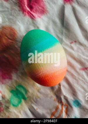 Close up of a colorful dyed Easter egg on white background. Stock Photo