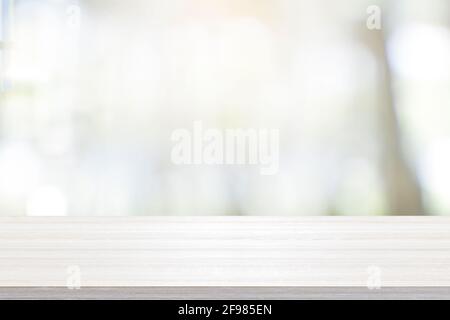 Empty wooden table for present product on coffee shop blur backg Stock Photo