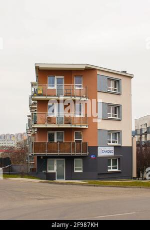 POZNAN, POLAND - Apr 07, 2016: POZNAN, POLAND - MARCH 13, 2016: Apartment block with a Candeo dentist office on the Stare Zegrze area on a cloudy day Stock Photo